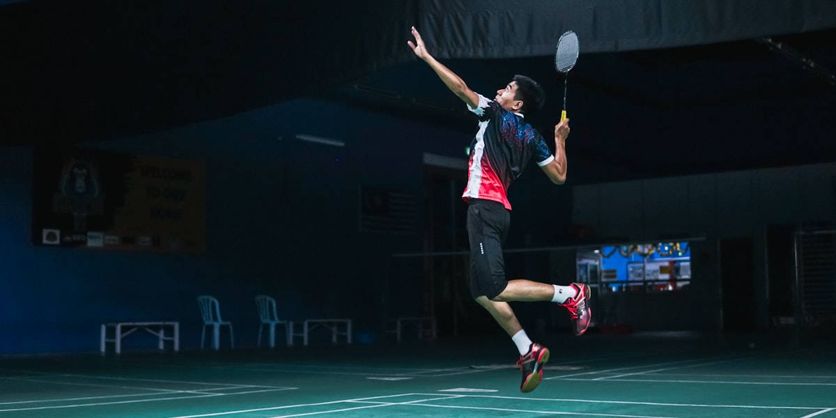 Badminton player leaping for a smash