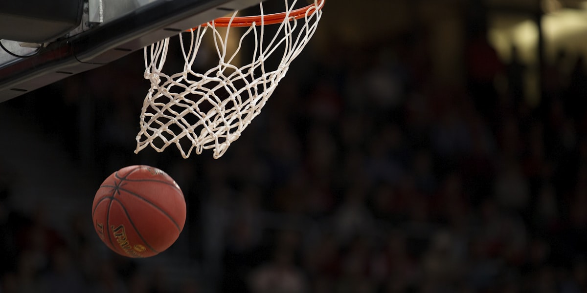 Basketball dropping through the net